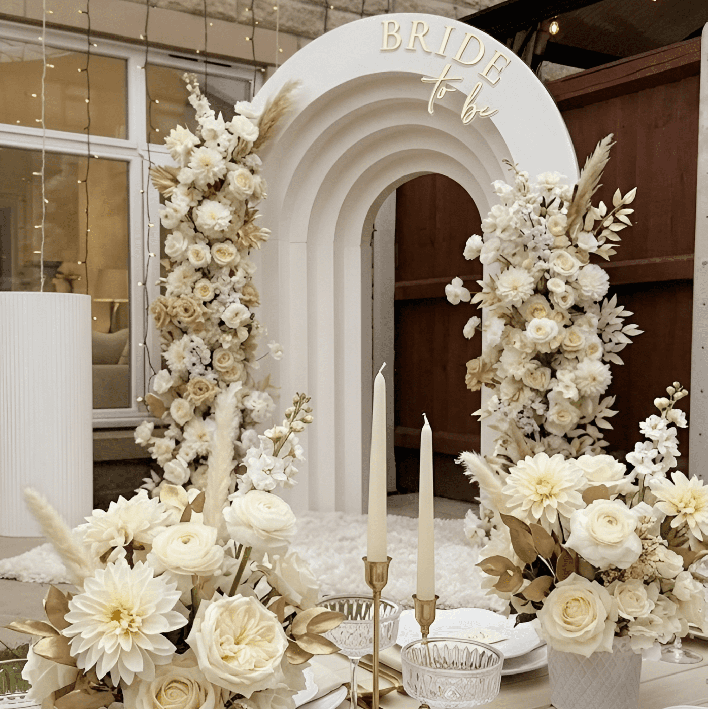 Chic pink and gold bridal shower "Bride to Be" backdrop with floral decor